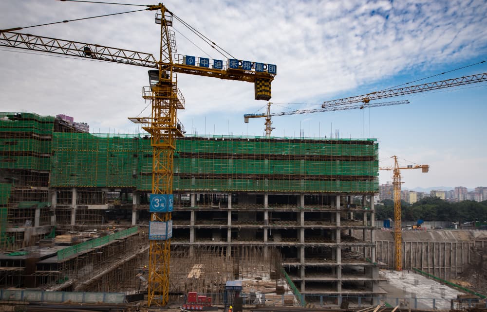 Large-scale construction site with multiple tower cranes